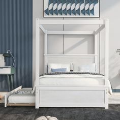 a white bed sitting in the middle of a bedroom