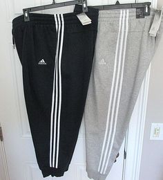 New with tags women's adidas Essentials 3-Stripe Fleece Joggers Available in size 1X in Medium Gray Heather or 4X in Legend Ink/White (Navy Blue) Inseam 1X=27.5 inches - 4X=26 inches Elastic waistband with outer drawcord 2 side pockets Ribbed hem Fleece-lined 53% cotton / 36% polyester / 11% rayon Retail on tag $45.00 (Size 1X is missing retail price) ID#8750 Slim Fit Joggers, Womens Adidas, Cuffed Joggers, Joggers Pants, Active Wear Pants, Fleece Joggers, Jogger Pants, Adidas Women, Active Wear