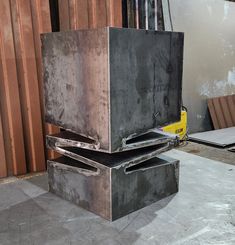 two metal boxes stacked on top of each other