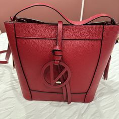 Brand New With Tag Size H10.5-W13-D6 Red Top Handle Bucket Bag With Gold-tone Hardware, Red Crossbody Bucket Bag With Gold-tone Hardware, Red Shoulder Bucket Bag With Gold-tone Hardware, Red Shoulder Bag With Branded Hardware, Luxury Red Satchel Hobo Bag, Designer Red Rectangular Bucket Bag, Luxury Red Tote Bag, Red Bucket Shoulder Bag With Gold-tone Hardware, Red Bucket Bag With Gold-tone Hardware For Shopping