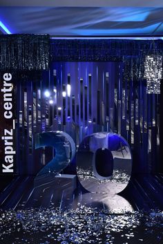 the number twenty two is displayed in front of a stage with lights and streamers