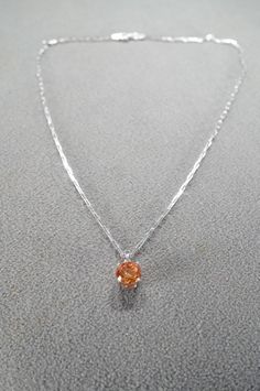 I am offering you this gorgeous vintage bold sterling silver (stamped) pendant and necklace chain, with a gorgeous extra large round shaped genuine intense Madera citrine stone set in it. This stone has color saturation and intensity that is endless, as seen in the provided pictures. What an eye catcher! It has the classic highly desired thick prong setting, with very thick substantial under work on all sides. It gives this such allure and extra interest. It weighs 4.5 grams. the pendant measures app.  .75 inch by app. 1/4 inch, this is including the large bail. The necklace chain is a sturdy oblong link, that measures a very versatile 18 inches in length.  What a fantastic gift this would make!  Please review all of my pictures, as they are all a very important part of my listing / descri Formal Orange Round Pendant Necklace, Orange Round Pendant Jewelry For Formal Occasions, Formal Orange Sterling Silver Necklace, Round Amber Necklaces Fine Jewelry, Fine Jewelry Silver Citrine Necklace, Silver Citrine Necklace In Fine Jewelry Style, Orange Citrine Round Jewelry, Citrine Stone, Single Stone