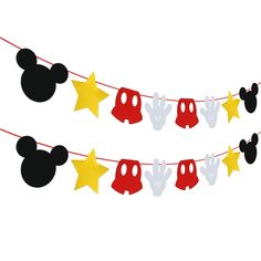 mickey mouse party decorations on a string with yellow stars and red minnie mouse heads hanging from them