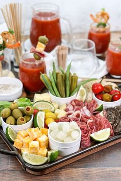 a platter filled with assorted meats and veggies