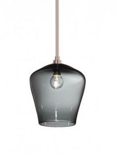 a gray glass light hanging from a ceiling