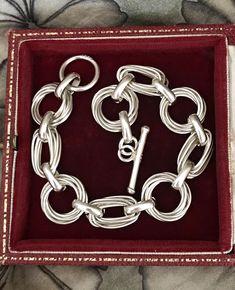 This outstanding Solid Sterling Silver Bracelet features intricately "wrapped" links interspersed with thick wide links. The bracelet is superbly designed and has a gleaming pristine appearance. It boasts a lush higly polished finish and is very eye-catching on the arm. The bracelet has a T Bar and toggle clasp and is tactile, flexible and slinky. This bracelet has that mellow, glowing sheen typical of genuine vintage and antique solid silver.    Hallmarks: 925 for Sterling Silver on the large r Antique Jewelry Victorian, Silver Hallmarks, Victorian Jewellery, Vintage Jewelry Antique, Vintage Bangle Bracelets, Vintage Bangles, Dark Mark, Large Ring, Victorian Jewelry