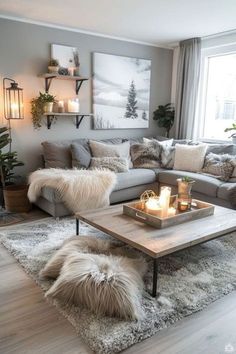 a living room filled with lots of furniture and candles on top of a coffee table