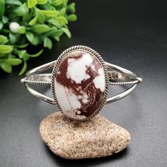 Visit our online shop at: Etsy.com/shop/AlbuquerqueDesigns *sterling silver bracelet *cuff  *southwestern jewelry *wild horse / white stone with dark red matrix *big free-shaped stone *cuff length before bending: 6 inches *open gap: 1" to 1.5" *comfortable fit for hand wrist size 6.5" to 7.75" *signed: * The back of jewelry items are all covered/do not show the back of stones *all jewelry items are made to ship, slight variations in stones will occur compared to pictures. *size of a penny is 19m Southwestern White Cuff Bracelet As Gift, Southwestern Style White Cuff Bracelet As Gift, White Stone Bracelet, Horse White, Horse Bracelet, Free Shapes, Hand Wrist, Wild Horse, Southwestern Jewelry