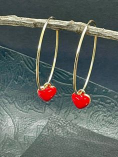 Elevate your accessory collection with these exquisite Gold filled Hoop With Red Enamel Heart Hoop Earrings, featuring a striking red heart design. Crafted with precision, these earrings combine elegance and playfulness, making them perfect for both casual and formal occasions. The vibrant red hue adds a pop of color, while the gold filled finish ensures durability and a luxurious shine. Ideal for gifting or personal indulgence, these heart-shaped hoops are a charming addition to any jewelry ens Red Heart Design, Red Heart Earrings, Grass Valley, Heart Hoop Earrings, Earrings Heart, Gold Filled Hoops, Hoop Earrings Gold, Jewelry Earrings Hoops, Heart Earrings