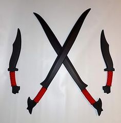 three knives with red handles and black blades