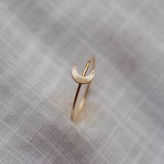 For the minimalist moon lovers out there. Our Luna Ring is perfect on its own or in any ring stack. - Made with 14k gold filled or sterling silver material - 1mm thick band - 6x5mm crescent moon shaped accent Please note: You may experience a slight color difference in places where the metal has been soldered making every piece truly unique. If you do not see your size, please reach out to us by email at info@hellorising.com. We believe that everyone deserves to wear beautiful jewelry. Purchase Silver Rings For Women Unique, Sun And Moon Rings, Ring Moon, Aesthetic Rings, Modern Gold Jewelry, Unique Silver Jewelry, Minimal Ring, Essentials List, Stacking Ring Set