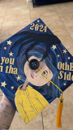 a hand holding a graduation cap that says, you can't take the side