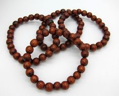 "8mm Hawaiian Style Koa bead stretch bracelet.  Beautiful natural Koa wood fashioned in to 8mm round beads strung to fit a 6-7\" wrist.  Bracelet is strung on high strength nylon stretch filament.  Tropical Acacia tree is found throughout the tropics and is also native to Hawaii. Longer lengths are available upon request. Shipped free to your home or office direct from Here in Hawaii.  Bring home a little taste of Aloha!" Brown Stretch Bracelet With 8mm Round Beads, Wood Fashion, Acacia Tree, Koa Wood, Hawaiian Style, Bead Stringing, Bead Leather, Beaded Stretch Bracelet, Stretch Bracelets