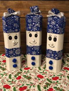 three snowmen made out of toilet paper