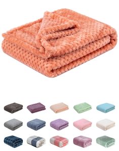 several colors of towels stacked on top of each other