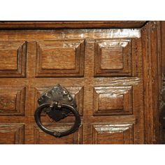 a wooden door with a metal handle on it