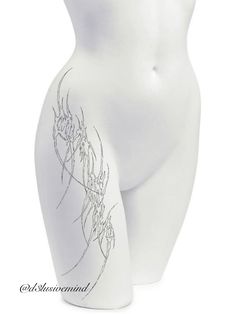 a white mannequin with an artistic design on it