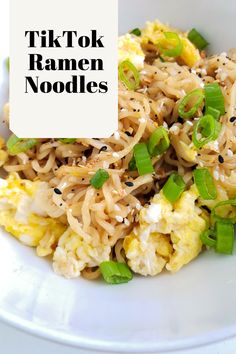 a white plate topped with noodles and vegetables