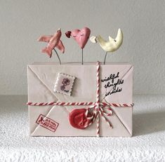 an envelope decorated with hearts and mail stamps