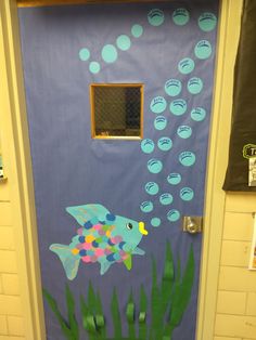 a door decorated with an image of a fish and bubbles