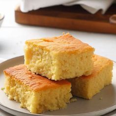 three pieces of cake sitting on top of a plate