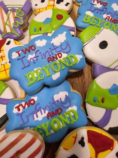 some decorated cookies are sitting on a table