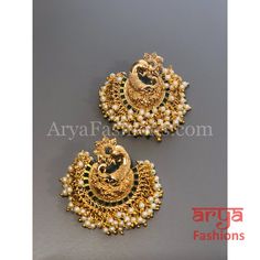 Saba Amrapali Inspired Golden Polki Chandbali Earrings Premium Quality Polki Chandbali Earrings Length: Approx. 2" Light-weight Push-Back closure Gold Finish on high-quality brass as the base metal, Kundan stones and Pearls Suitable for any traditional for contemporary attire and occasion In-stock & ready-to-ship **Color may vary slightly due to photography and lighting. Elegant Peacock Design Earrings For Puja, Ceremonial Peacock Chandbalis For Festivals, Peacock Design Chandbali Earrings For Puja, Chandbali Peacock Earrings For Puja, Gold Earrings With Peacock Design For Puja, Ceremonial Chandbali Earrings For Navratri, Navratri Celebration Earrings With Peacock Design, Peacock Design Earrings For Festivals, Bridal Chandbali Earrings With Peacock Design For Festivals