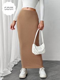 Flow through your day with effortless elegance in the Sahara Drift Maxi Wrap Skirt. Crafted in a warm camel tone, this knit skirt drapes beautifully, hugging your silhouette while offering all-day comfort. Its versatile wrap design allows for an adjustable fit, perfect for creating a chic high-waist or laid-back mid-rise look. Whether you're pairing it with a sleek bodysuit for a sophisticated evening ensemble or a cozy sweater for those casual coffee dates, the Sahara Drift brings understated l Wrap Maxi Skirt, Basic Design, Knit Wrap, Plus Size Maxi Dresses, Boot Bag, Camel Color, Basic Style, Skirt Outfits, Wrap Skirt