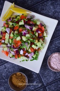 a white plate topped with cucumber and red onion salad