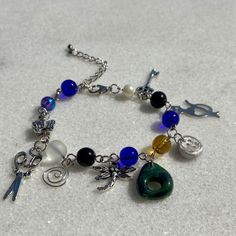 Handmade bracelet with various charms inspired by coraline movie.  🪡🧵 you can choose your favorite finish Bracelet, Necklace or both as a set 🤩 🪡🧵 You can choose the Size of your bracelet.  🪡🧵 The necklace length is standard 40Cm + 5CM extension. (feel free to message me for specifics necklace length ☺️) Charms included in this bracelet:  🧵 Wybie charm.  🪡 Cat charm.  🗿 seeing through charm. ✂️ scissor charm.  🗝️ key charm.  🧵Dragonfly charm.  🌟 Star charm.  🧵🪡 2 extra charms swir Coraline Charm Bracelet, Coraline Gift Ideas, Coraline Bracelet, Coraline Necklace, Coraline Film, Coraline And Wybie, Coraline Movie, Tiny Butterfly, Cat Bracelet