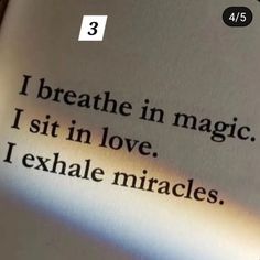 an open book with the words i breathe in magic, sit in love, exhale mirages