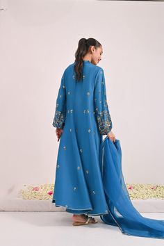 This beautiful three pieces is designed on pure teal blue raw silk in the signature Agha Noor long panelled pishwas silhouette, the balloon sleeves are heavily embellished with hand/ada zardosi work in dabka,naqshi,sequins and stones. Styled with a matching pure organza dupatta and pencil trousers. The length of the lo Pencil Trousers, Agha Noor, Zardosi Work, Organza Dupatta, The Balloon, Balloon Sleeves, Raw Silk, Teal Blue, Balloons