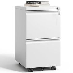 a white filing cabinet sitting on wheels with a stack of books on top of it