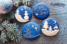 decorated christmas cookies sitting on top of a table