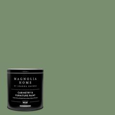 a can of green paint with the words magnolia home on it's front and side