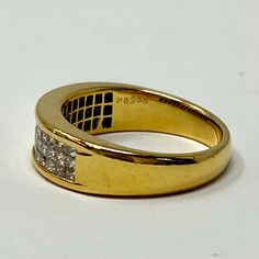 18K Gold Ring with Invisible Set Diamonds (includes appraisal, Value: $3,300, "36316-R8956") Designer = Ronzette Size = 6.5 Material = 18K Gold Gemstone = Diamond Condition = Excellent Class = Premier Location: Glencoe Item Number: 11405-1251 Item ID: 283176 Category: Ring Luxury Formal Diamond Ring With Single Cut Diamonds, Formal Fine Jewelry Diamond Ring With Pave Setting, Luxury Diamond Ring With Accents For Formal Occasions, Formal Pave Setting Diamond Ring, Formal Baguette Cut Ring With Pave Setting, Collectible Yellow Gold Rings With Diamond Accents, Luxury Gold Diamond Ring Collectible, Dazzling Diamond Ring With Pave Setting For Formal Occasions, Round Diamond Ring With Vs Clarity For Formal Events