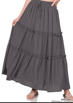 This full-length skirt is designed with an effortless pull-on waistband and a tiered A-line silhouette. This maxi style is made with a soft rayon fabric that's as lightweight as it is lovely, perfect for any day styling. Appx. 37"-38" length. True to Size Functional drawstring Elastic Waistband 100% Rayon WAIST: S- 26" M- 28" L- 30" XL- 32" 1X- 34" 2X- 36" 3X- 38" Maxi Skirt Fashion, Long Skirt Boho, Bohemian Maxi Skirt, Maxi Skirt Style, Ruffle Maxi Skirt, Chiffon Maxi Skirt, Flowy Maxi Skirts, Grey Maxi, High Waisted Maxi Skirt