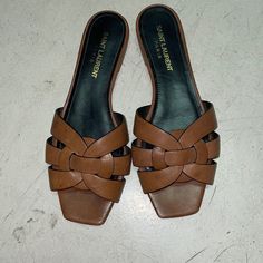 Saint Laurent Slide Sandals Made With Metal-Free Tanned Leather With Intertwining Straps. Comfortable And Stylish Ysl Tribute, Yves Saint Laurent Shoes, Flat Mules, Saint Laurent Shoes, Slide Sandals, Smooth Leather, Women's Shoes Sandals, Yves Saint Laurent, Shoes Sandals