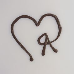 a heart shaped chocolate item with the letter q in it