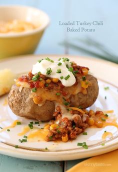 loaded turkey chili baked potato on a plate