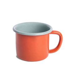 an orange and grey coffee mug on a white background with the lid down to show it's inner rim