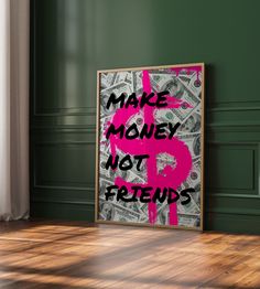 a pink dollar sign with the words make money not friends on it in front of a green wall