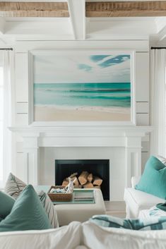 a living room filled with furniture and a fire place in front of a painting on the wall