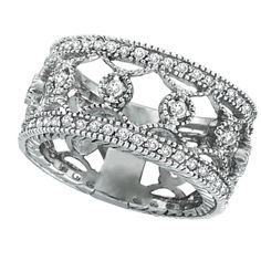 a white gold ring with diamonds on the sides and an intricate design in the middle