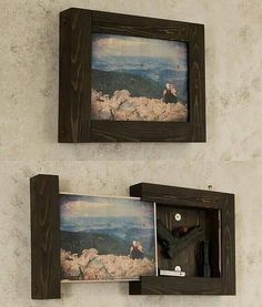 two wooden frames with pictures hanging on the wall