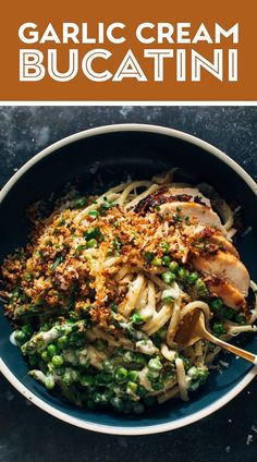 garlic cream bucatini with peas and chicken in a bowl