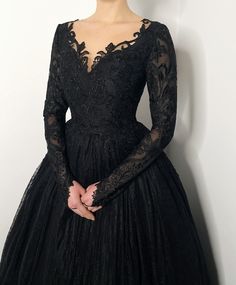 Orders for 2022 September - December are still being accepted! If you need the dress by September, October please choose express shipping! Made to order!! All black lace wedding gown. The skirt is made of many many layers of soft black tulle and the top layer is soft black lace. Bodice and long sleeves dekorated with a different yet matching lace. Hidden zipper closure and little black buttons. After you place the order, I will contact you and send the list of measurements I need. Along with ins Black Lace Prom Dress With Sleeves, Plus Size Gothic Wedding Dresses, Chotronette Dresses Black, Black Prom Dress Long Sleeve Lace, Dark Theme Wedding Dress, Satin Black Wedding Dress, Goth Bridal Shower Outfit, Black Wedding Dress Sleeves, Simple Black Wedding Dress With Sleeves