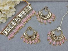 Gorgeous Sheesha and American Diamond CZ Work Choker Necklace set, comes with Earrings and Tikka, and Detailed Pearl Drop. Jewelry Care -- Keep all the jewelry away from water, perfumes, and other harsh chemicals To clean wipe with a lint-free cloth to retain the shine Please Note- No Returns No Exchange Pink Festive Sets With Stone Work, Pink Meenakari Jewelry For Eid, Festive Pink Jewelry Sets, Pink Festive Jewelry For Eid, Festive Pink Jewelry For Eid, Festive Pink Round Jewelry Sets, Pink Jewelry With Latkans For Eid, Pink Sets With Latkans For Diwali, Pink Latkans Sets For Diwali