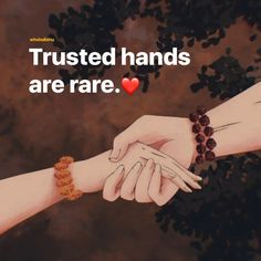 two hands holding each other with the words trust and trust