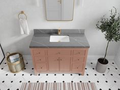 a bathroom with a sink, mirror and rug